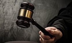 Hand holding a gavel