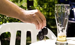 A empty beer glass and car keys