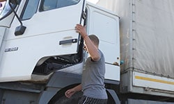 Male steping up into a truck